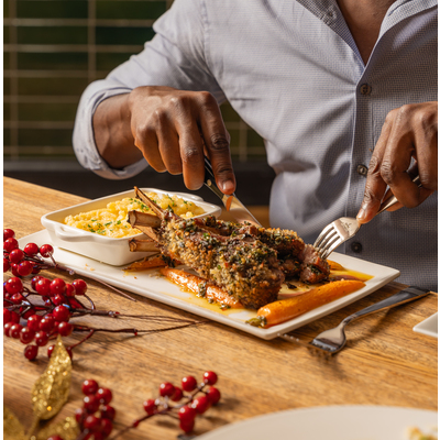 Person eating a fine dining meal.